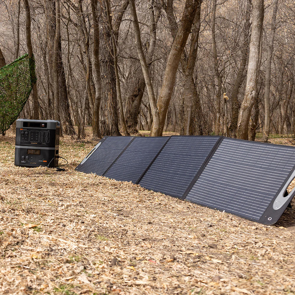 Grid Doctor 3300 EMP with Free 200W Solar Panel set up outdoors with the expansion battery.