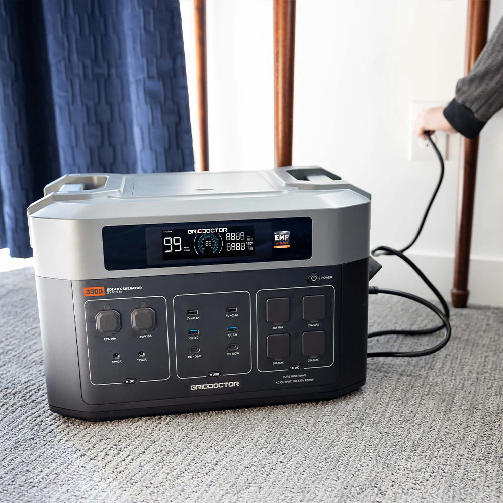 Grid Doctor 3300 EMP being plugged into a wall outlet to charge.