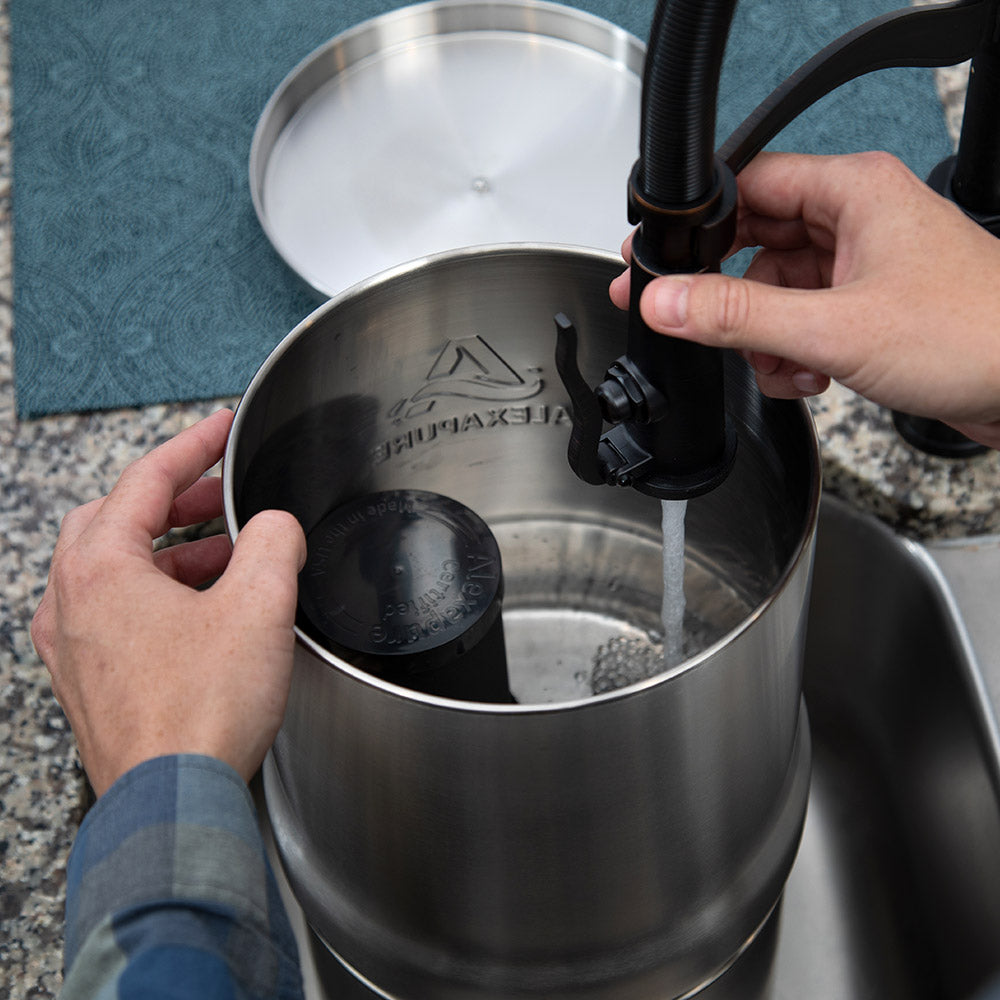 Alexapure Pro top down being filled in a sink.