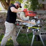 Man using miter saw outdoors powered by a portable station, showing off-grid work capability.