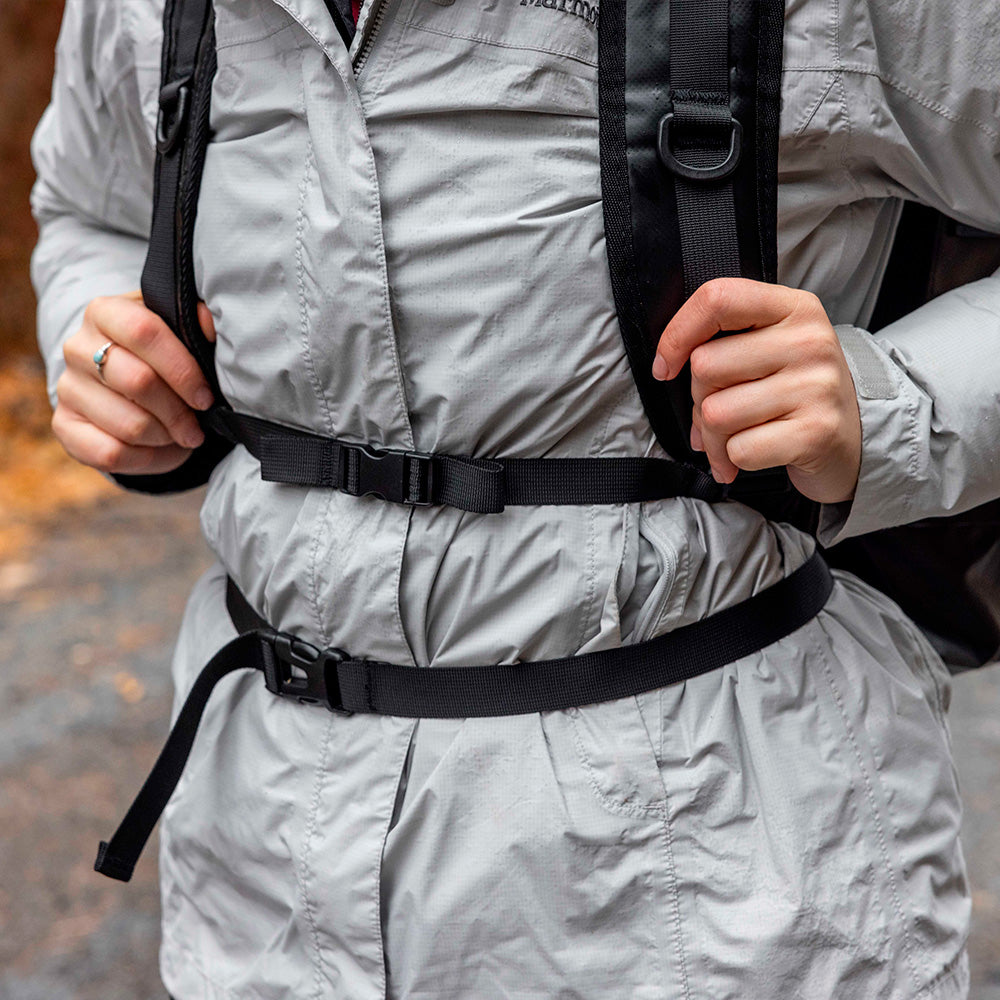 Person hiking with waterproof backpack