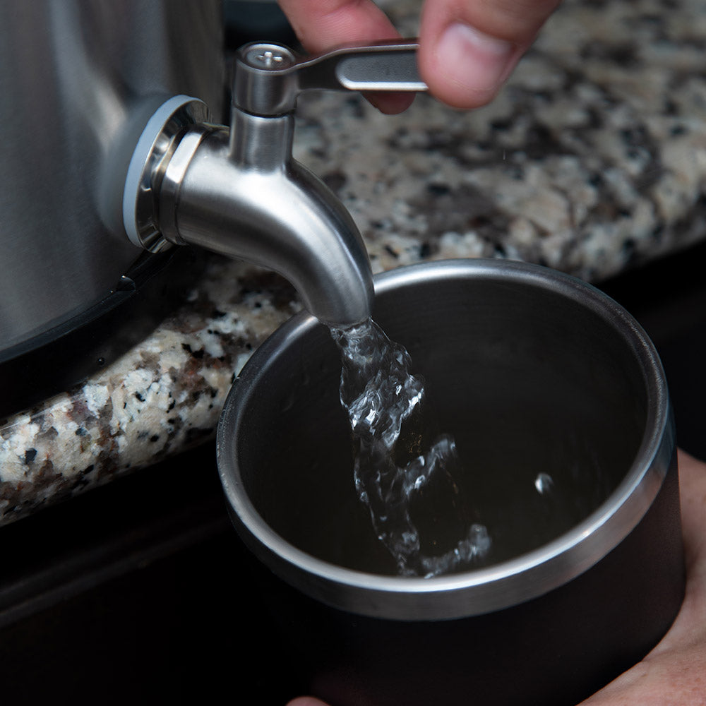 Alexapure Pro filling a coffee cup.